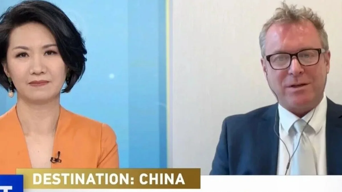 Liu Xin and Justin Downes in a split-screen interview about inbound tourism to China